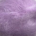 Bella By Permin. Et lekkert mohairgarn som består av 75 % kid mohair, 20 % ull og 5% polyamid. Strikkefasthet: 14 m x 22 p på pinne 6. Leveres i 50 grams nøster som utgjør 145 meter. Her i fargen 883281 Violett.