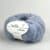 Nellie By Permin, kidmohair og silke. Inneholder 55% superfine alpaca, 24% bomuld, 21% merinould. 18-20 masker x 28-30 pinner = 10 cm. Her i fargen 412 lyseblå/rosa/burgunder